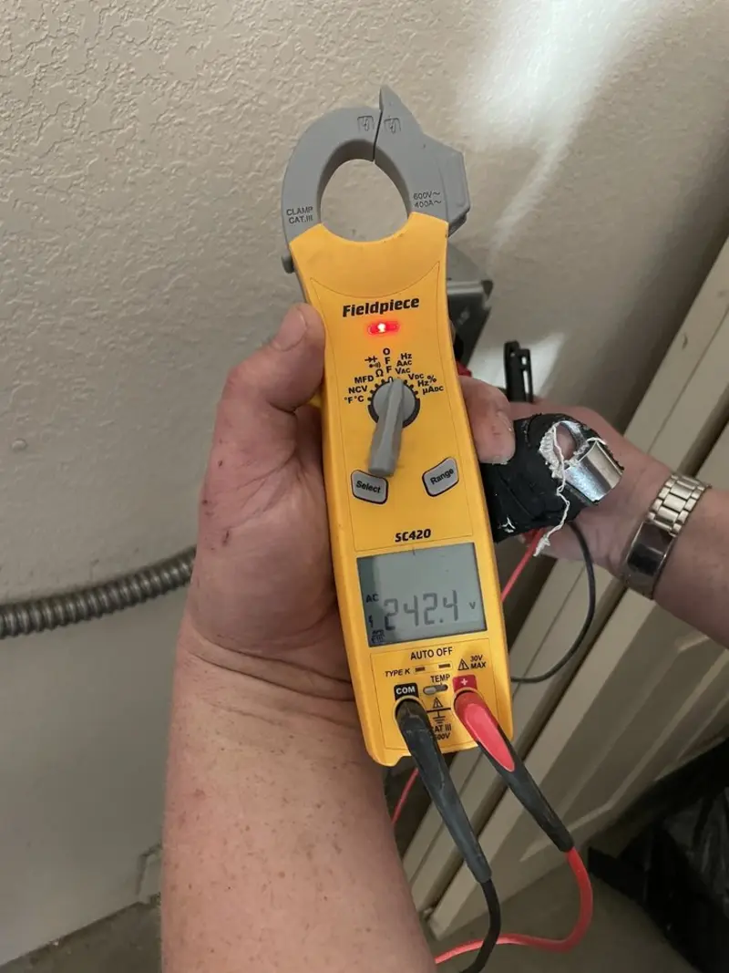 Voltage testing with clamp meter during Ceiling Fan Installation in Brooklyn